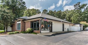 A "Contact Us" graphic features silhouettes of a dog and cat against a cityscape background, representing a veterinary or pet-related service - Veterinarian in Raleigh NC A "Contact Us" graphic features silhouettes of a dog and cat against a cityscape background, representing a veterinary or pet-related service - Veterinarian in Raleigh NC